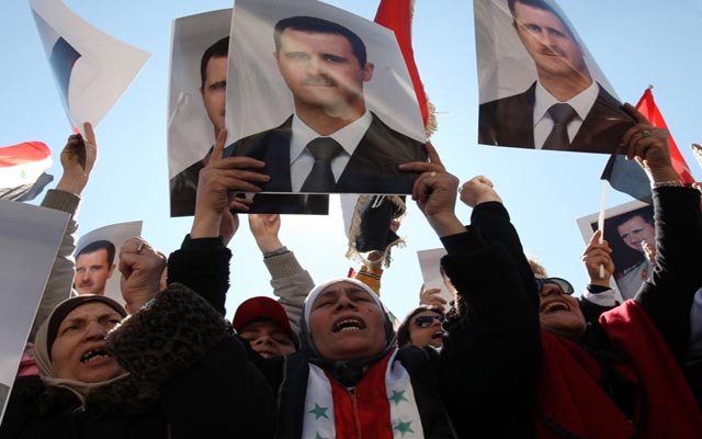الصورة: أنصار الأسد في مظاهرة تأييد بدمشق في 5 فبراير 2012. (أ ف ب)