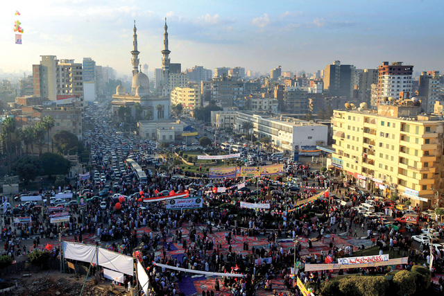 "مصريون يؤدون صلاة أول «أضحى» بعد الثورة في ساحة مدينة المنصورة شمال القاهرة"