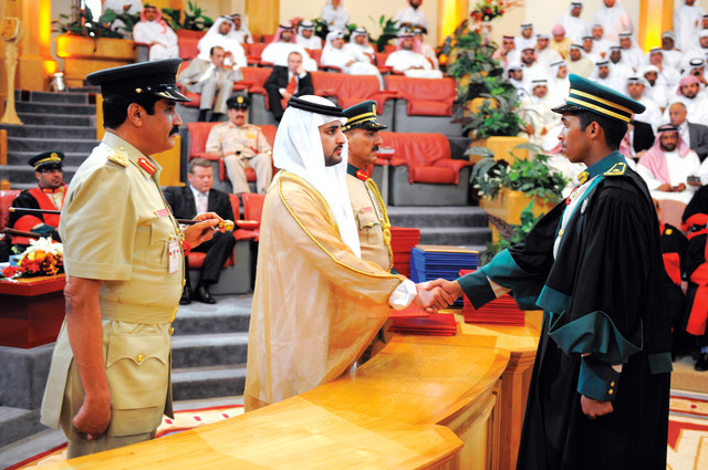 ".. وسموه يصافح أحد الخريجين"