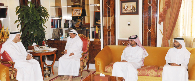 "حميد النعيمي لدى استقباله عبدالرحمن العويس بحضور عمار بن حميد"