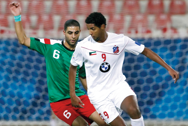 "التونسي عصام جمعة في مشاركة سابقة مع الكويت أمام الوحدة الأردني \tأرشيفية"