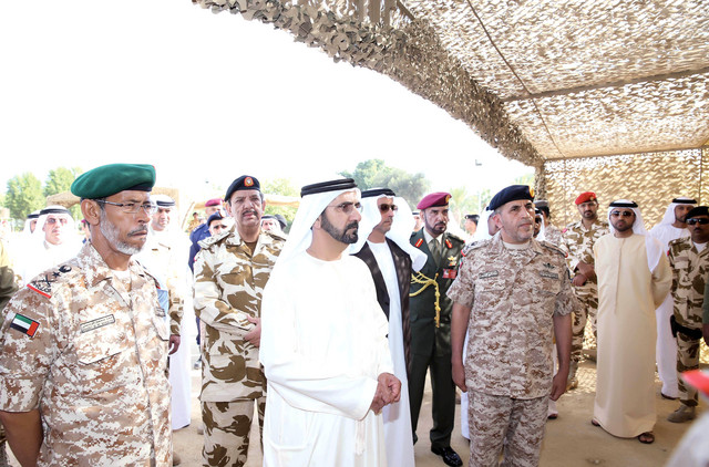 "محمد بن راشد خلال زيارته قواتنا المسلحة المشاركة في درع الجزيرة بالبحرين بحضور سيف بن زايد وحمد الرميثي وسالم الغفلي"