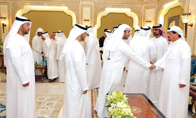 "حميد النعيمي مستقبلًا المهنئين بحضور عمار بن حميد"