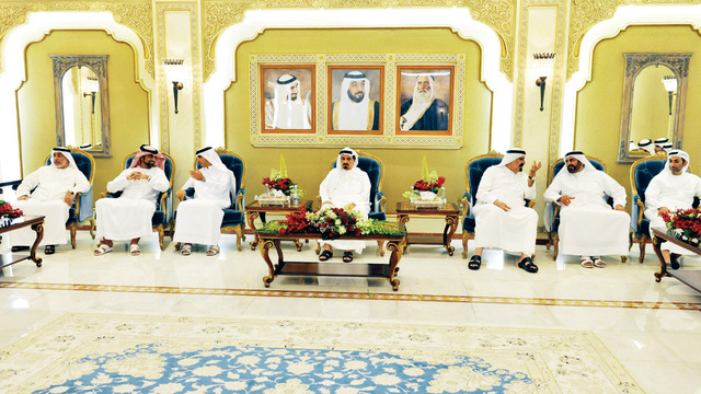 "وحاكم عجمان بحضور ولي العهد خلال استقبال المهنئين"