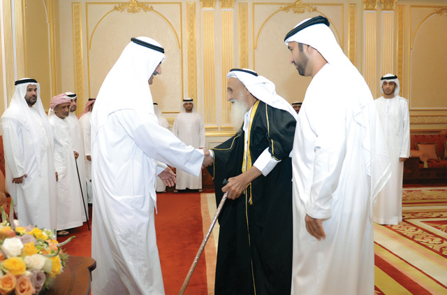 ".. ويتقبل التهاني من أحد كبار السن"