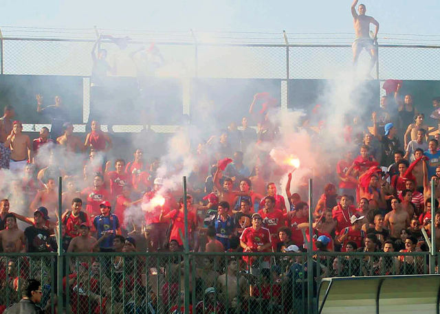 "مدرج الالتراس بعد إطلاق الشماريخ \t تصوير - سعيد عبد الحميد"