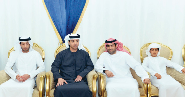 "هزاع بن زايد خلال تقديم واجب العزاء لنجلي الفقيد"