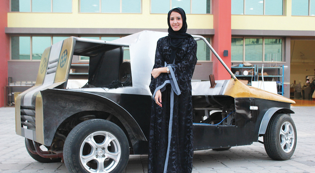 "ريم المرزوقي بجانب السيارة التي تحمل اسم \"النظام الجديد\"\t البيان"