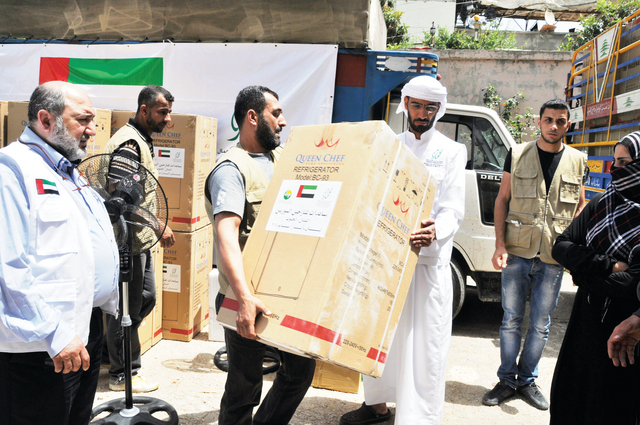 "توزيع الثلاجات على الأسر السورية المستفيدة"