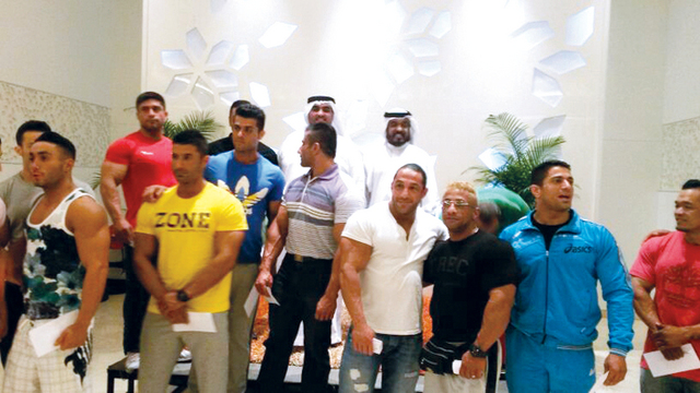 "عبد الكريم مع الأبطال خلال الاحتفالية"