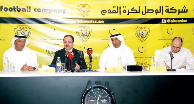 "أشرف أحمد وبسام أديب والفلاسي أثناء توقيع الاتفاقية \tالبيان"