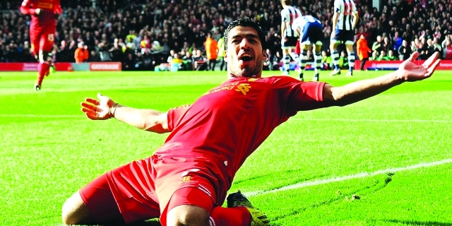 "LIVERPOOL, ENGLAND - OCTOBER 26: ( THE SUN OUT, THE SUN ON SUNDAY OUT) Luis Suarez of Liverpool celebrates his first goal during the Barclays Premier League match between Liverpool and West Bromwich Albion at Anfield on October 26, 2013 in Liverpool, England. (Photo by Andrew Powell/Liverpool FC via Getty Images)"
