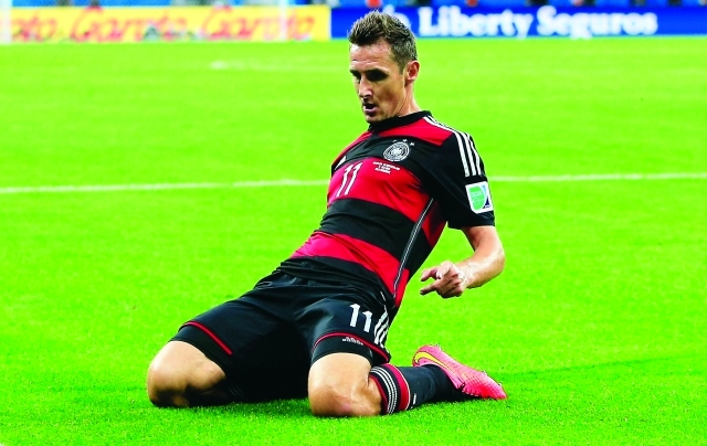 "TOPSHOTS Germany's forward Miroslav Klose celebrates after scoring during the semi-final football match between Brazil and Germany at The Mineirao Stadium in Belo Horizonte during the 2014 FIFA World Cup on July 8, 2014. AFP PHOTO / ADRIAN DENNIS"