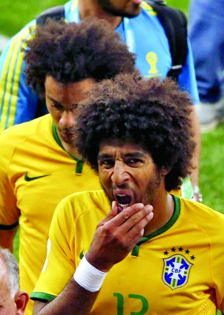 "Brazil's Dante (R) and Marcelo react after they lost their 2014 World Cup semi-finals against Germany at the Mineirao stadium in Belo Horizonte July 8, 2014. REUTERS/David Gray (BRAZIL - Tags: SOCCER SPORT WORLD CUP)"