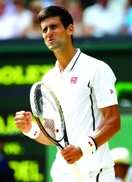 "Novak Djokovic of Serbia reacts after winning a point against Juan Martin Del Potro of Argentina during their Men's singles semifinal match at the All England Lawn Tennis Championships in Wimbledon, London, Friday, July 5, 2013. (AP Photo/Alastair Grant)"