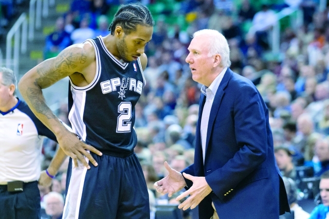 "Nov 15, 2013; Salt Lake City, UT, USA; San Antonio Spurs head coach Gregg Popovich talks with small forward Kawhi Leonard (2) during the second half against the Utah Jazz at EnergySolutions Arena. San Antonio won 91-82. Mandatory Credit: Russ Isabella-USA TODAY Sports"