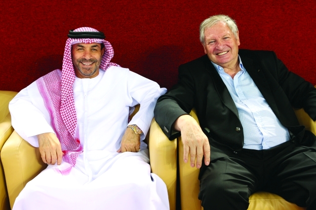 "الفرنسي إيفان مانيني وعبد الله الأنصاري خلال متابعتهما البطولة أمس"
