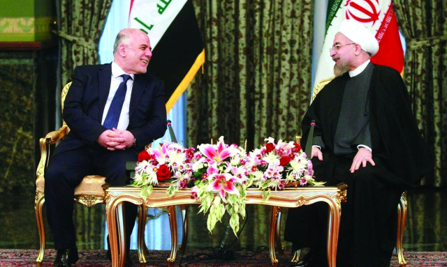 "روحاني مستقبلاً العبادي في طهران  \t    أ.ف.ب"