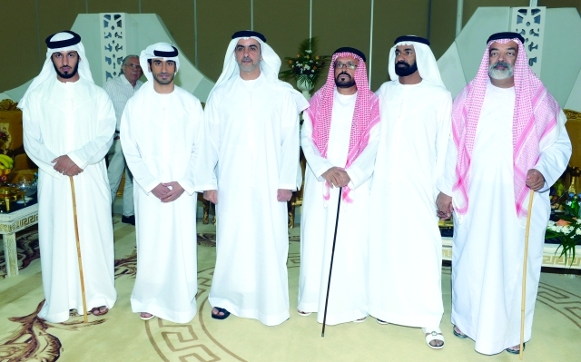 "سيف بن زايد والعريس ووالده والحضور"