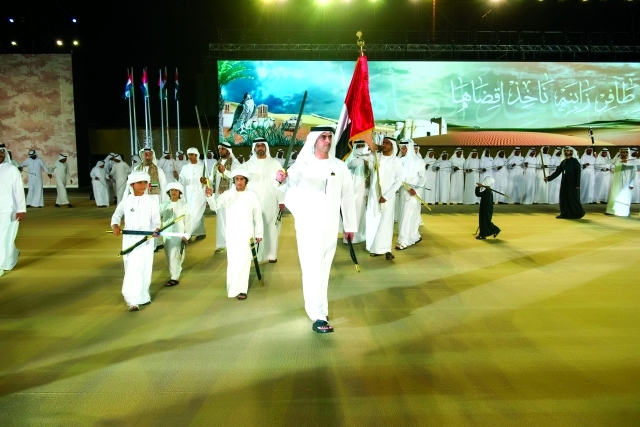 "سيف وحامد بن زايد خلال مشاركتهما الاحتفال باليوم الوطني"