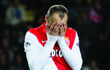"Monaco's Dimitar Berbatov reacts after missing a chance to score during the Champions League Group C soccer match between Monaco and Zenit St. Petersburg at Louis II stadium in Monaco, Tuesday, Dec. 9, 2014. (AP Photo/Lionel Cironneau)"