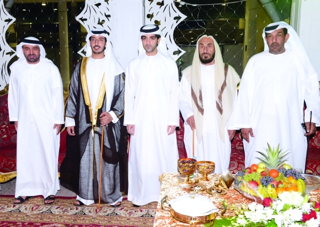 "هزاع بن طحنون والعريس ووالده ووالد العروس"