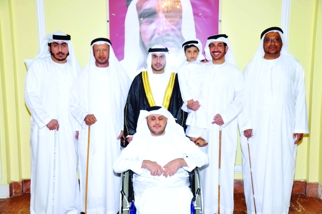 "العريس يتوسط سالم وعبد الله وصالح وماجد وعلي والطفل سعود"