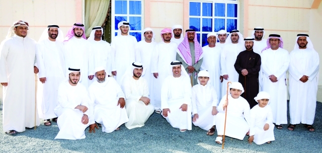 "فيصل بن سلطان القاسمي والعريس ووالده وجمع من الأهل"