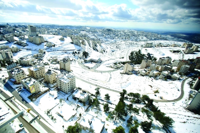 "الثلوج تغطي شوارع رام الله ــ أ. ف. ب"