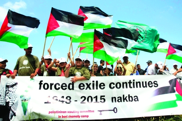 "أطفال فلسطينيون يحيون ذكرى النكبة في بلدة الناقورة اللبنانية - أ.ب"