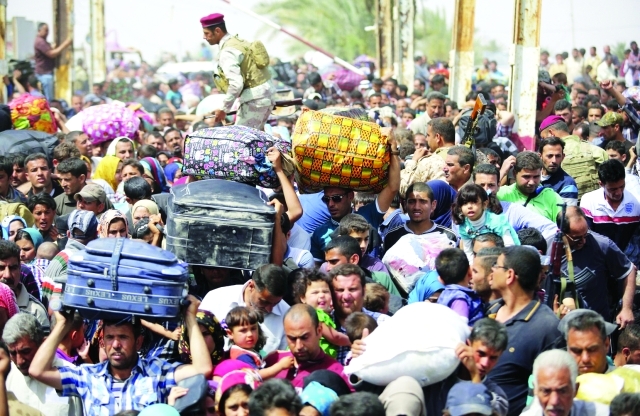 "■ مئات الآلاف فروا من الموصل إثر سيطرة داعش على المدينة | أرشيفية"
