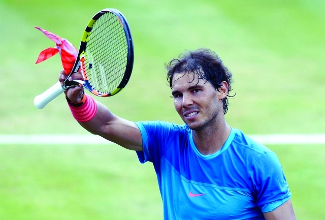 "Spain's Rafael Nadal reacts after defeating France's Gael Monfils in their semifinal match at the ATP Mercedes Cup tennis tournament in Stuttgart, southern Germany, on June 13, 2015. Nadal defeated Monfils 6-3 and 6-4.AFP PHOTO / THOMAS KIENZLE"