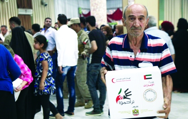 "■ توزيع الطرود على اللاجئين والنازحين في أربيل | وام"