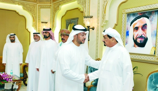 "■ حاكم عجمان وولي عهده خلال استقبال المهنئين"