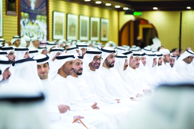 "محمد بن زايد خلال المحاضرة بحضور راشد بن سعود المعلا وحمدان بن زايد ومحمد المر ونهيان وسيف وعبد الله وخالد بن زايد ونهيان بن مبارك | وام"