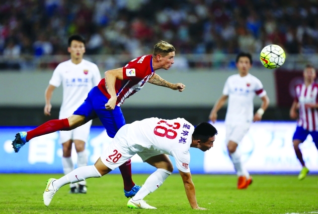 "■ توريس خلال مباراة شنغهاي أمس | رويترز"