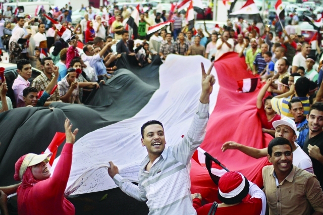 "■ مصريون يحتفلون في ميدان التحرير | أ.ب"
