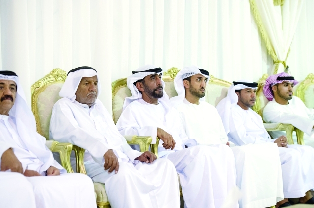 "■ محمد المزروعي وجمعة البواردي وجانب من الحضور خلال العزاء"