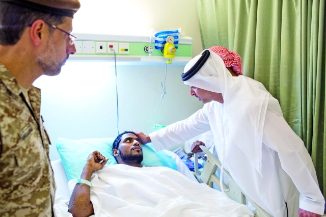 "■ هزاع بن زايد يطمئن على صحة أحد المصابين"
