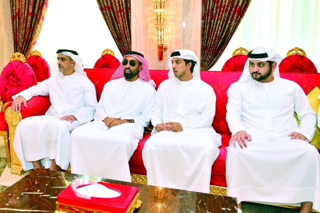 "■ مكتوم بن محمد وسيف وطحنون ومنصور بن زايد خلال العزاء"