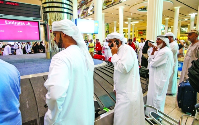 "■ الحجاج في مطار دبي الدولي خلال عودتهم إلى أرض الوطن | البيان"