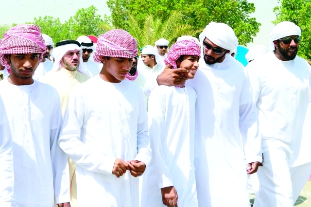 "■ أشقاء الشهيد ونجله الأكبر"