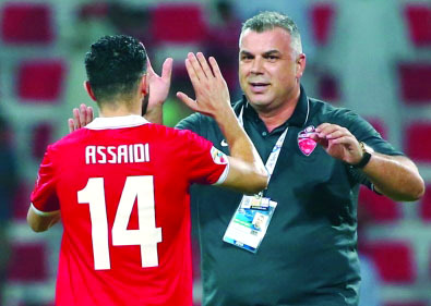 "■ كوزمين يحتفل بالفوز مع اسامة السعيدي | البيان"