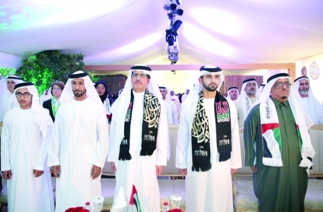 "Ⅶ منصور بن محمد وضاحي خلفان وسعيد الطاير خلال السلام الوطني | وام"