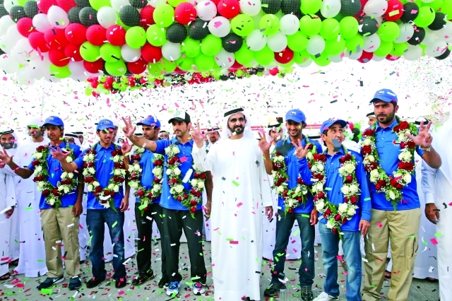 "■ محمد بن راشد خلال استقباله فرساننا أبطال أوروبا 2014"