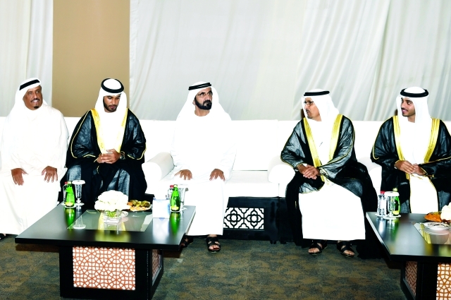 "سموه مع العريسين ووالدهما وضاحي خلفان"