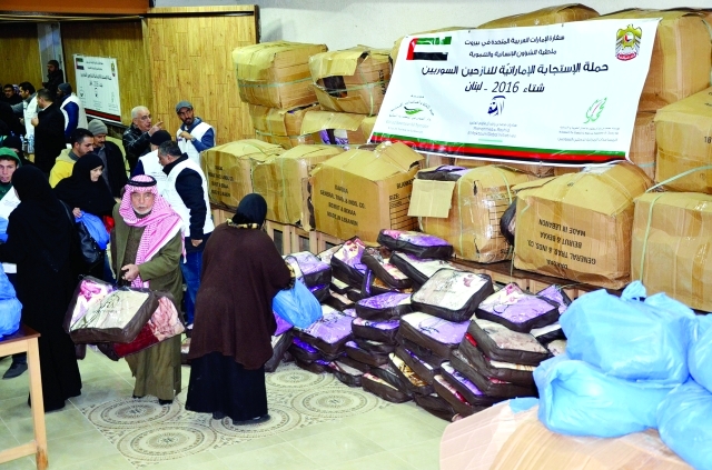 "■ أثناء توزيع مساعدات مؤسسة محمد بن راشد للأعمال الخيرية | من المصدر"