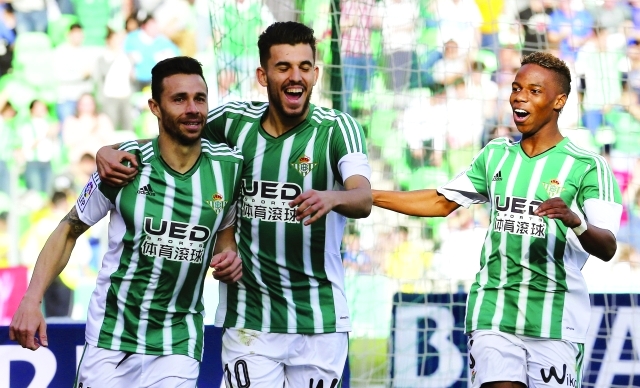 "Real Betis' striker Ruben Castro (L) jubilates with his team mates, Dani Ceballos (C) and Belgian Charly Musonda (R) his goal against Valencia FC during their Primera Division soccer League match played at Benito Villamarin stadium in Seville, Andalusia, Spain on 07 February 2016. EFE/Jose Manuel Vidal"