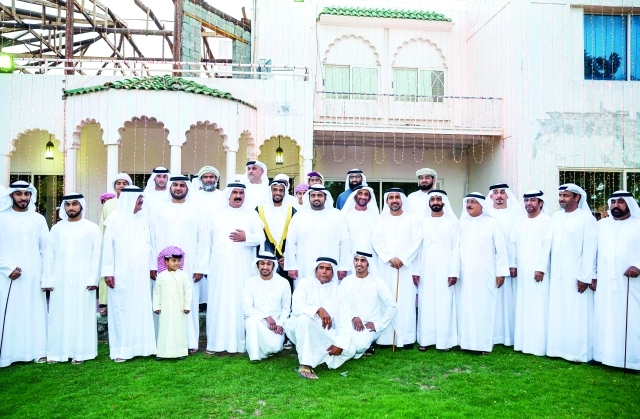 "محمد بن حمد خلال مشاركته افراح المزروعي والمدحاني"