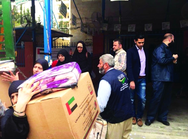 "جانب من توزيع المساعدات | وام"